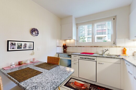 kitchen with white dishwasher, white cabinets, tasteful backsplash, stainless steel oven, and light stone countertops