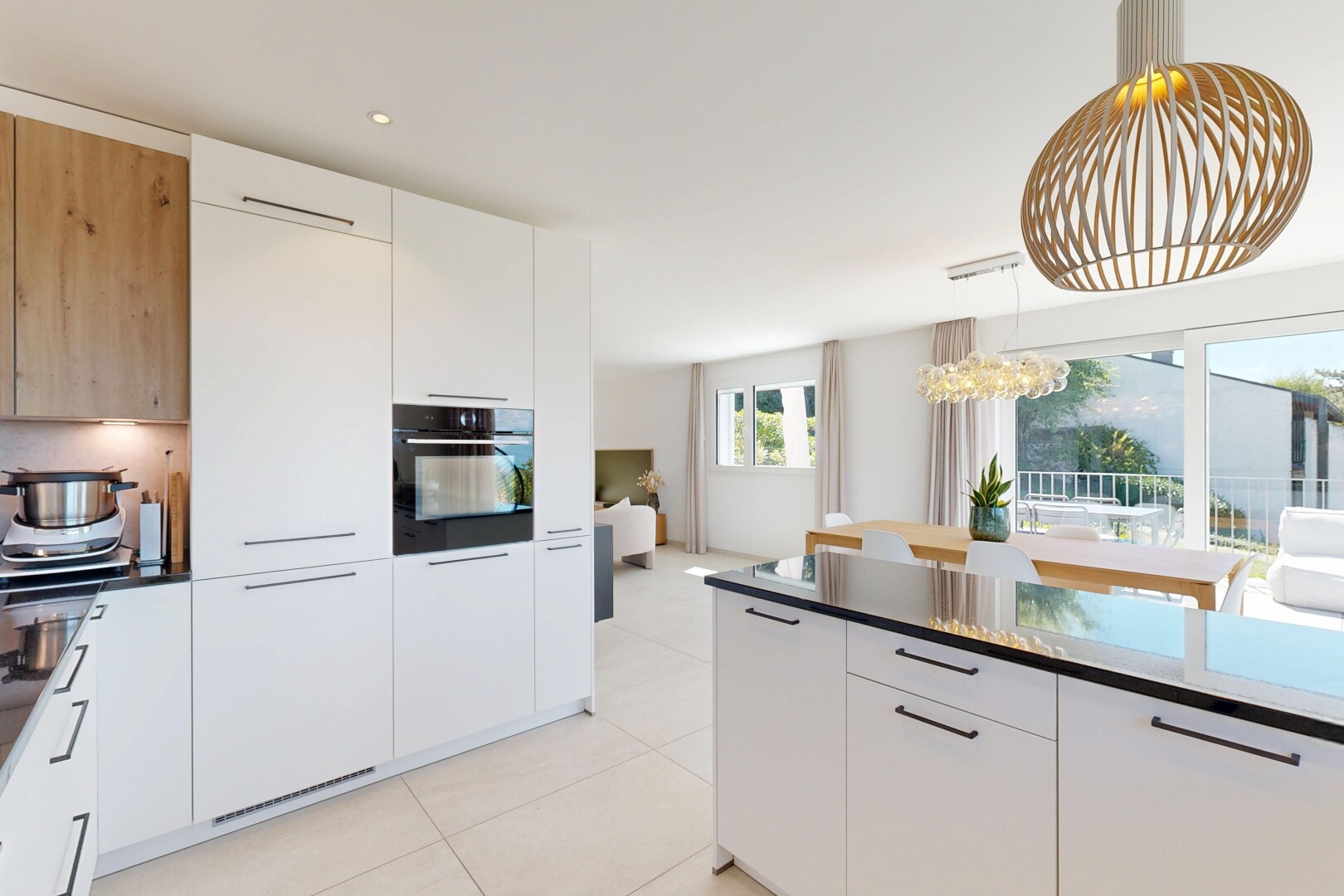 cuisine avec white cabinets, armoires blanches, dark countertops, light floor, et flat panel cabinets