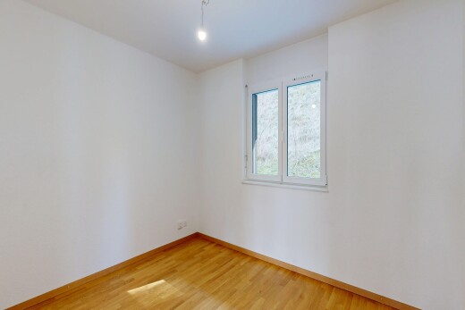 empty room with light wood-style flooring and baseboards