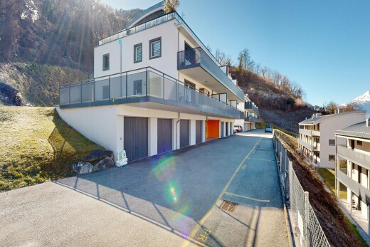 view of property with a balcony and stucco siding