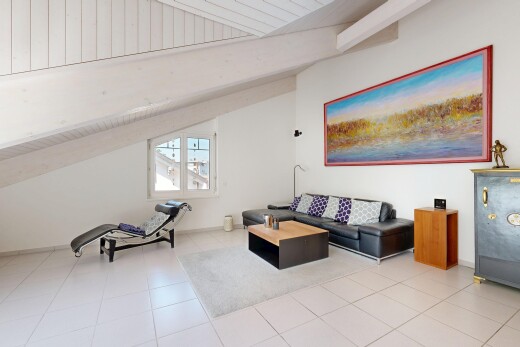 living room with lofted ceiling with beams and light tile patterned floors