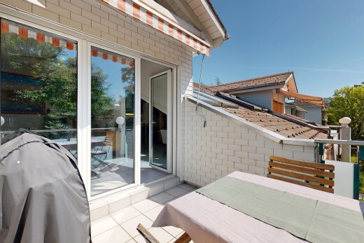 patio / terrace with a grill