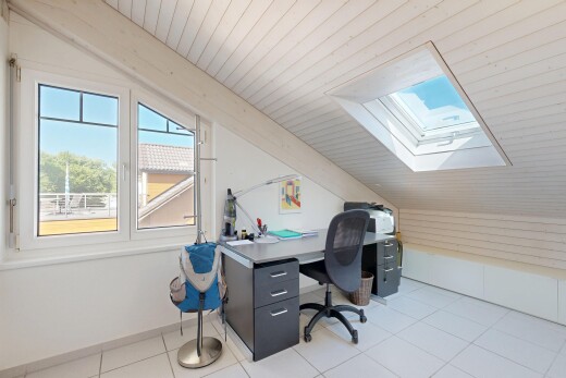 office space with plenty of natural light, vaulted ceiling with skylight, wood ceiling, and light tile patterned flooring