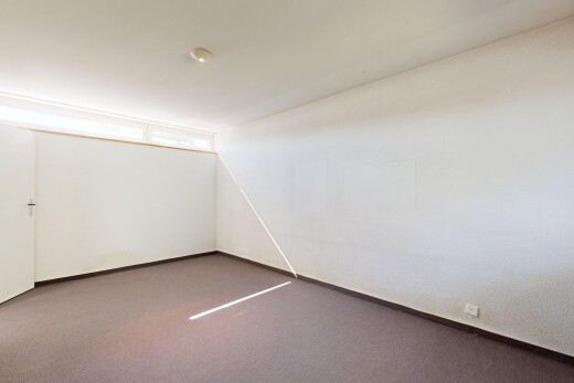 empty room with carpet and baseboards