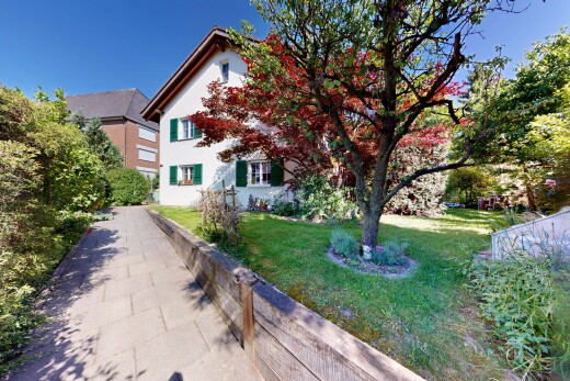 façade avec day time, pelouse, property visible, et bardage en stuc