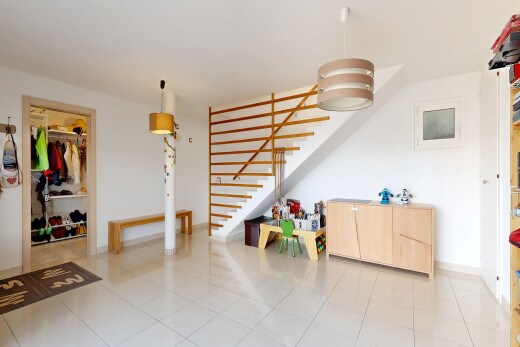 stairs featuring tile patterned floors and baseboards