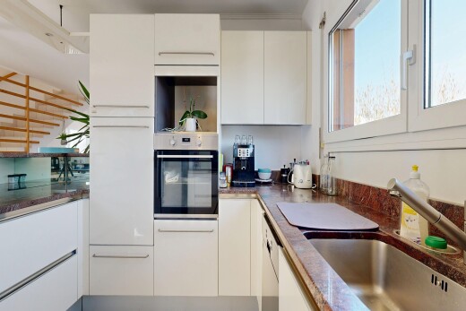 kitchen with oven, open shelves, white cabinetry, modern cabinets, and dark stone countertops