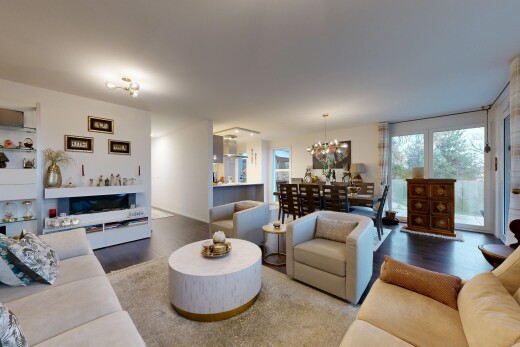 living / dining room with wood finished floors and a chandelier