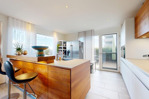 kitchen with light countertops, stainless steel appliances, recessed lighting, modern cabinets, and dual tone cabinets