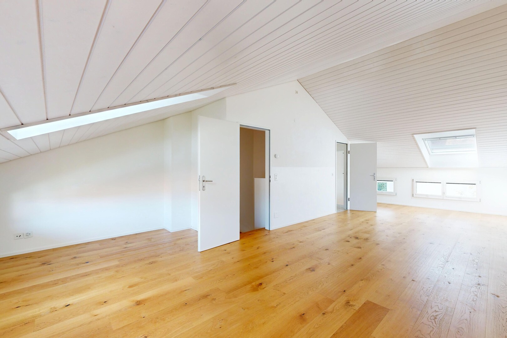 empty room featuring light wood-style flooring and a vaulted wooden ceiling
