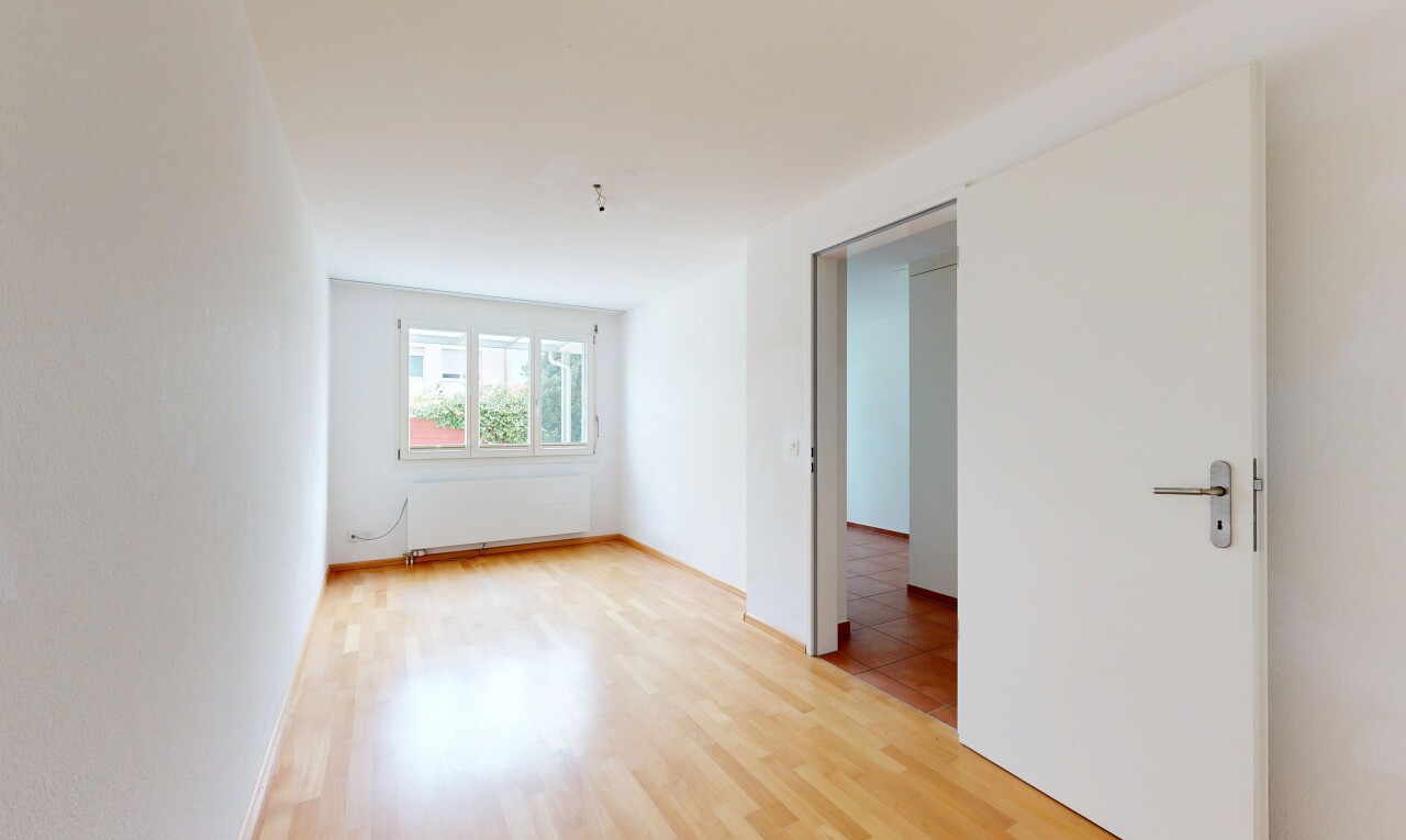 empty room with radiator and light wood finished floors