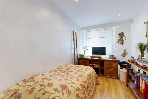 room featuring light wood finished floors, an office area, and recessed lighting