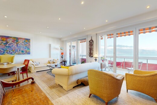 living room with access to exterior, recessed lighting, and light wood-style flooring