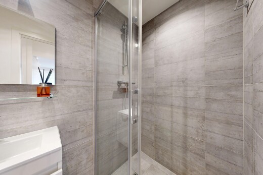 bathroom featuring a stall shower and vanity