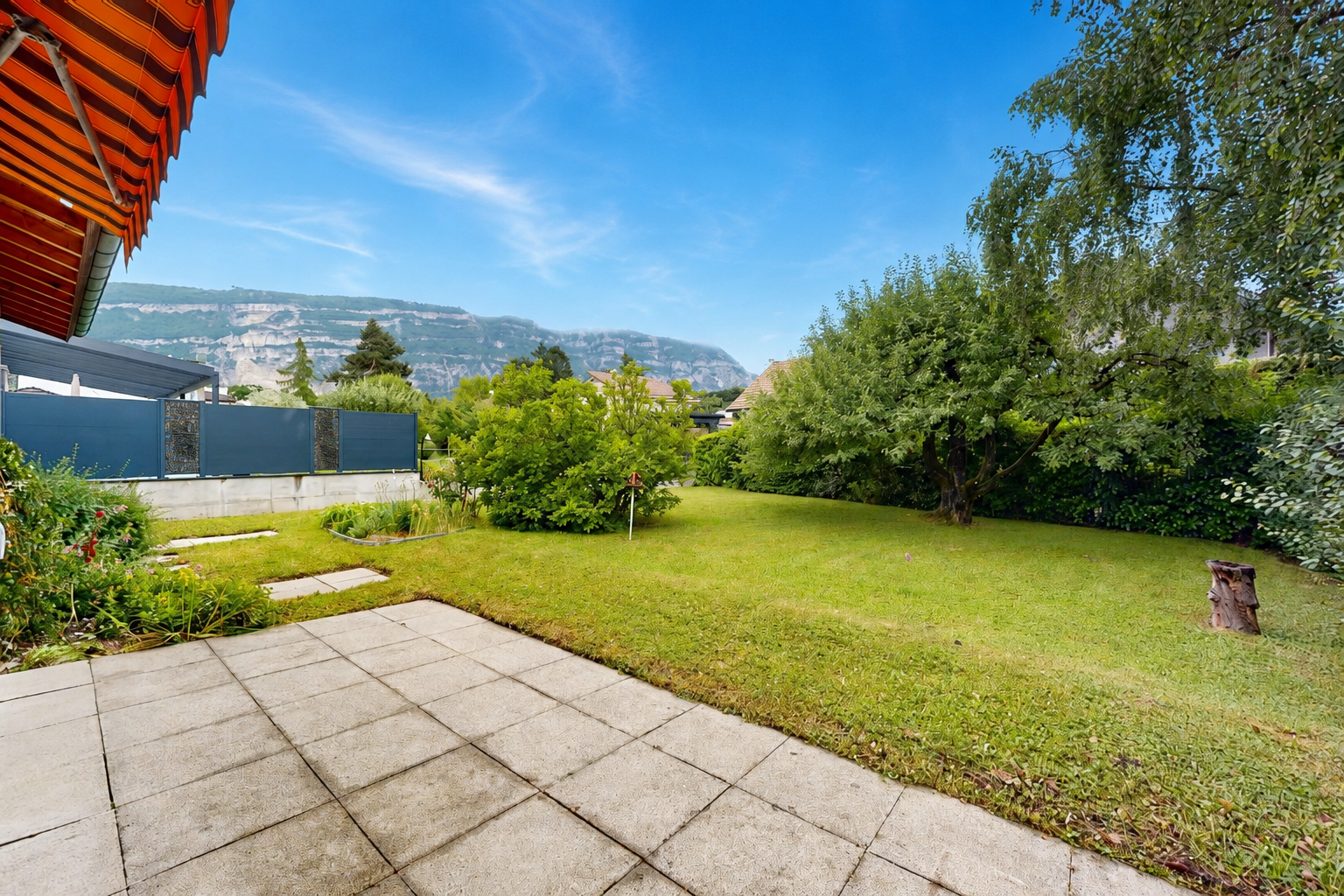 garden featuring a mountain view and a yard