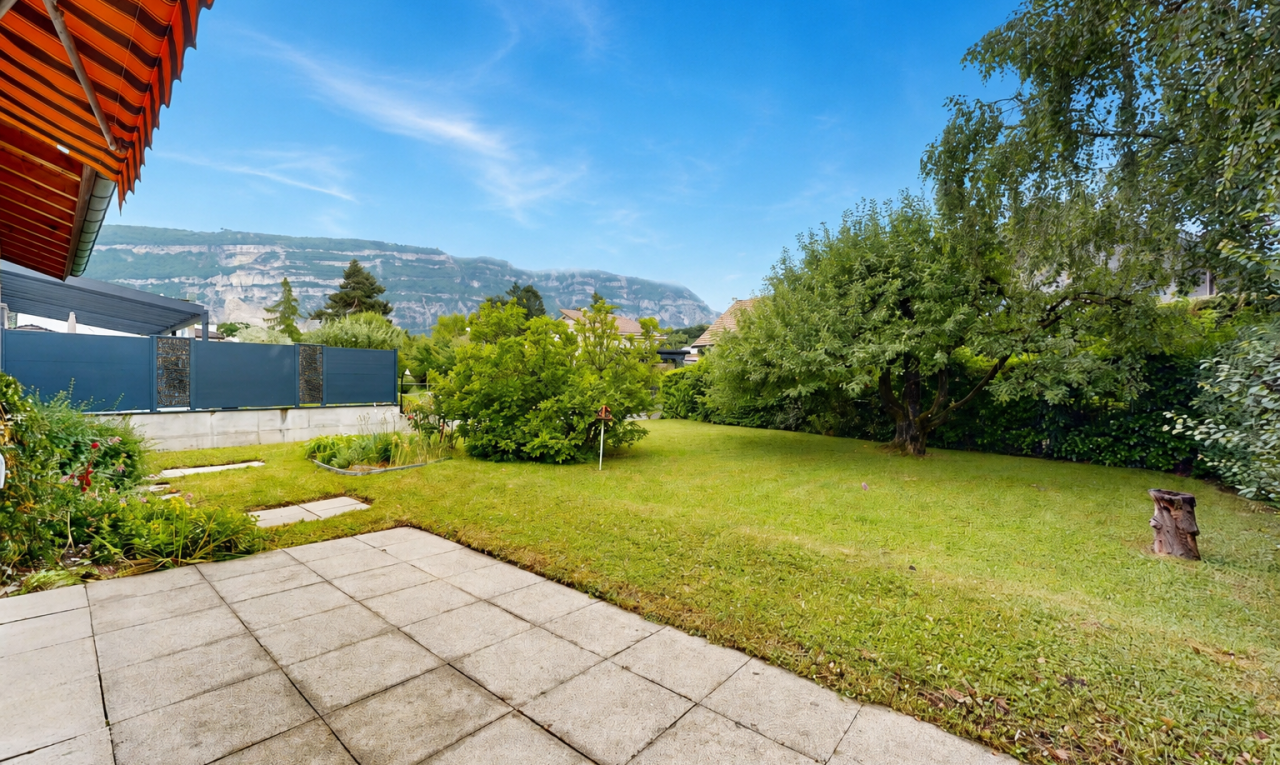 garden featuring a mountain view and a yard
