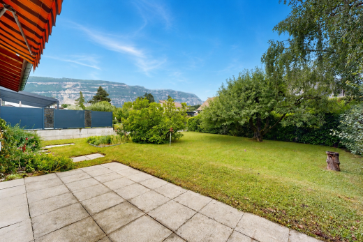 garden featuring a mountain view and a yard