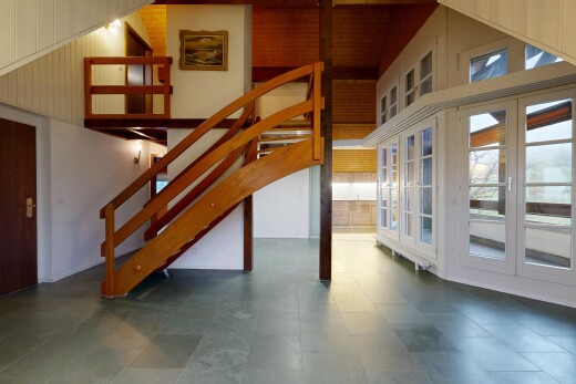 stairs featuring a towering ceiling
