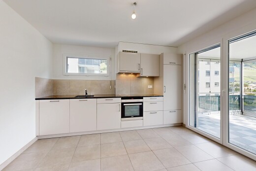 kitchen featuring stainless steel oven, decorative backsplash, dark countertops, and light tile patterned flooring