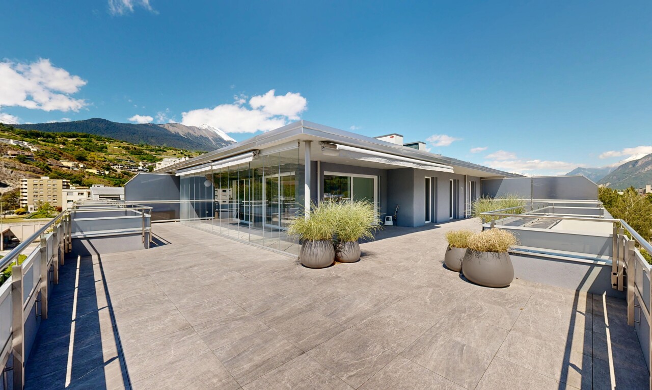 terrace with a patio area and a mountain view