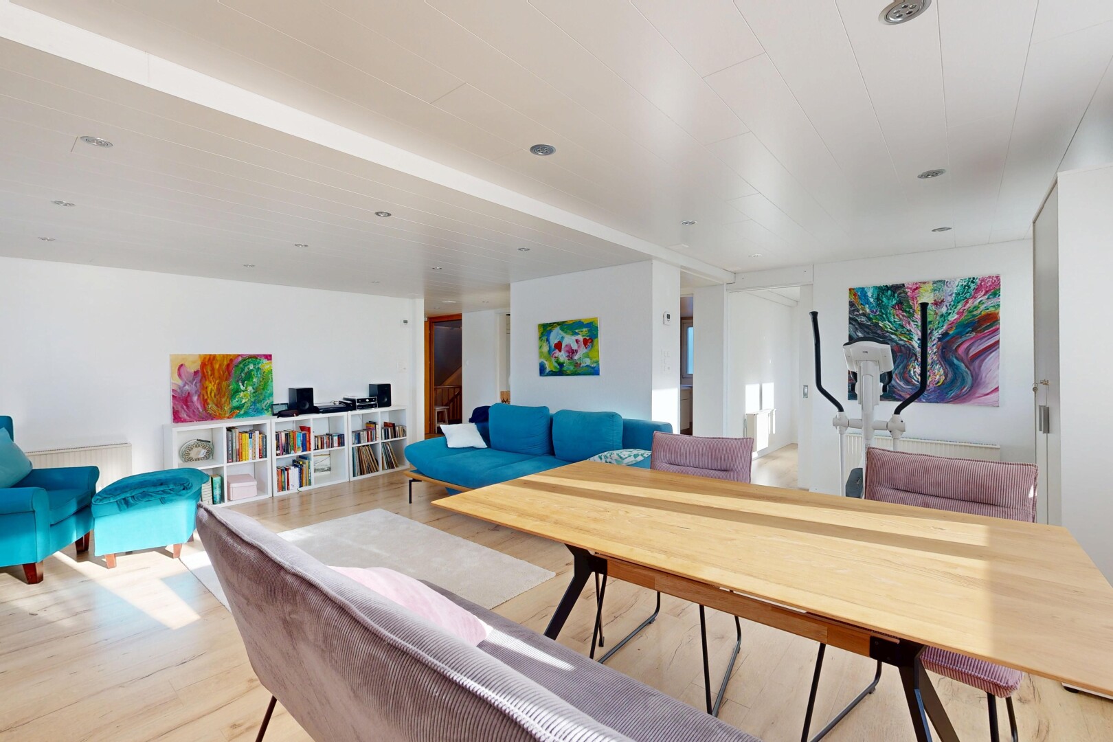 living room featuring light wood-style floors and stairway