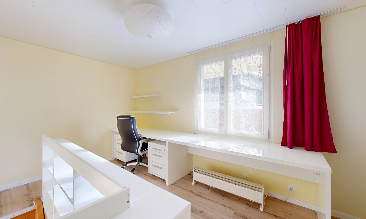 office area with a baseboard heating unit and light wood-type flooring