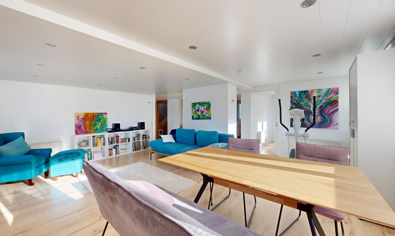 living room featuring light wood-style floors and stairway