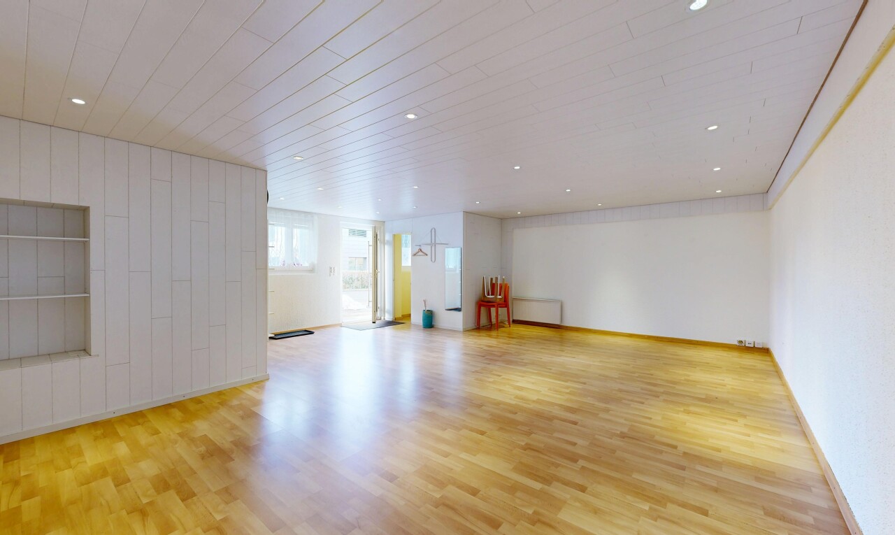 spare room with light wood-style flooring, recessed lighting, and radiator
