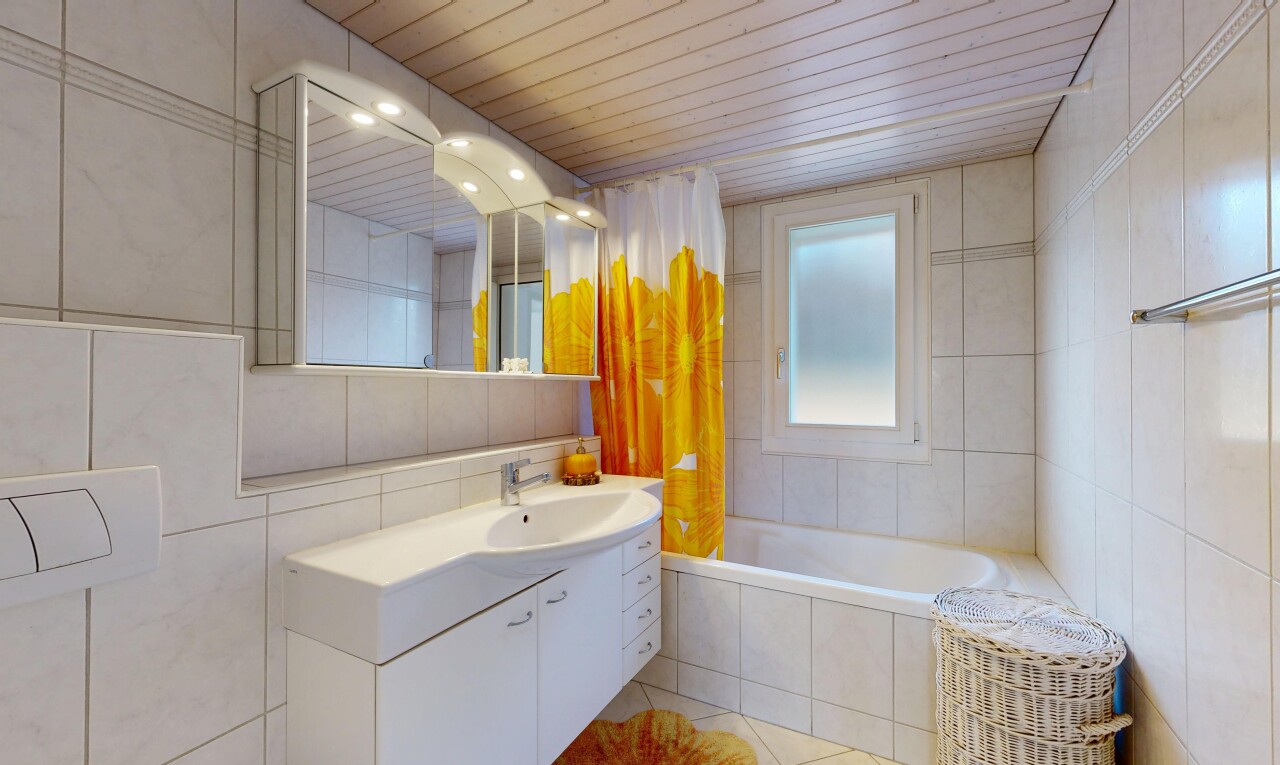 full bath featuring tile walls, vanity, tiled tub, wood ceiling, and light tile patterned flooring