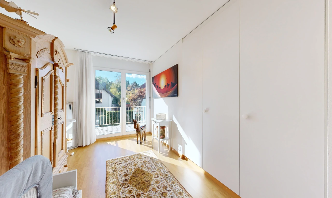 room with access to outside and light wood finished floors
