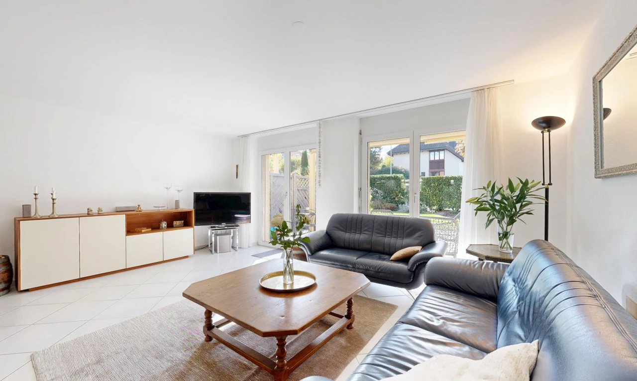 living room featuring access to exterior and light tile patterned floors
