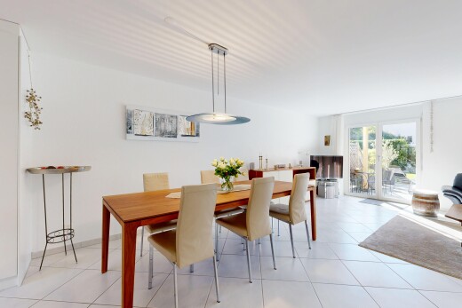 dining room featuring access to exterior and light tile patterned floors