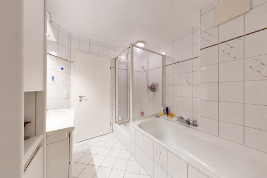 bathroom featuring a shower stall, tile walls, vanity, a bath, and light tile patterned floors