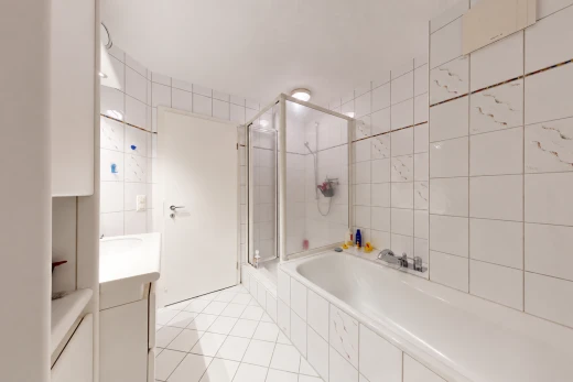 bathroom featuring a shower stall, tile walls, vanity, a bath, and light tile patterned floors