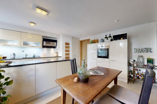 küche mit dark countertops, ofen, light floor, schränke mit glastüren, und glass insert cabinets