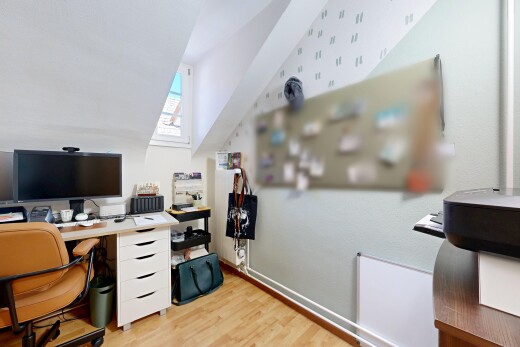 büro mit fernseher, zusätzliches zimmer, holzfußboden, wood finish floor, und inside property