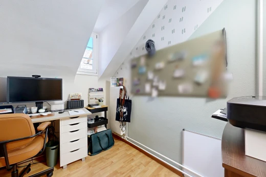 büro mit fernseher, zusätzliches zimmer, holzfußboden, wood finish floor, und inside property
