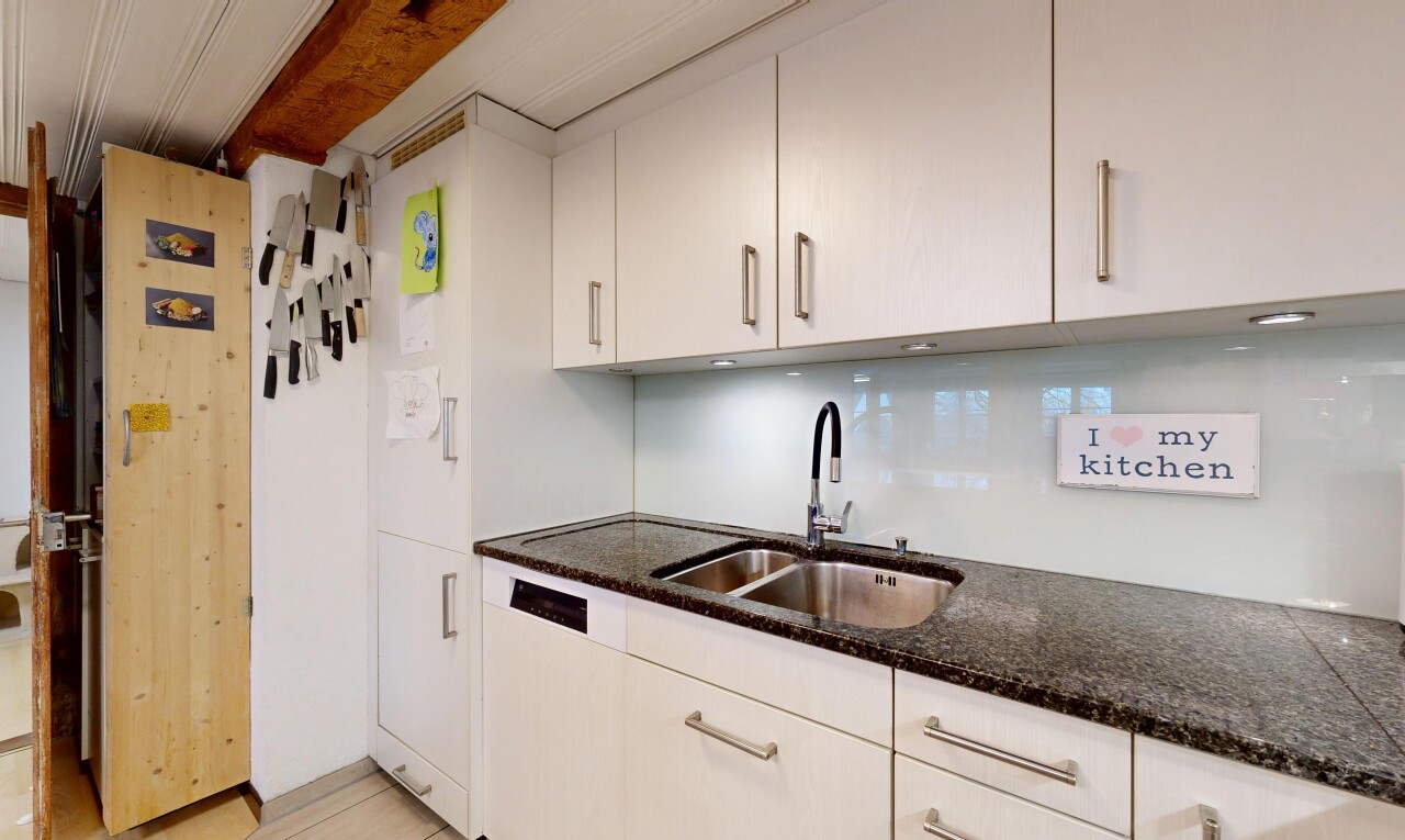 küche mit inside property, waschbecken, stein arbeitsplatten, und weiße schränke