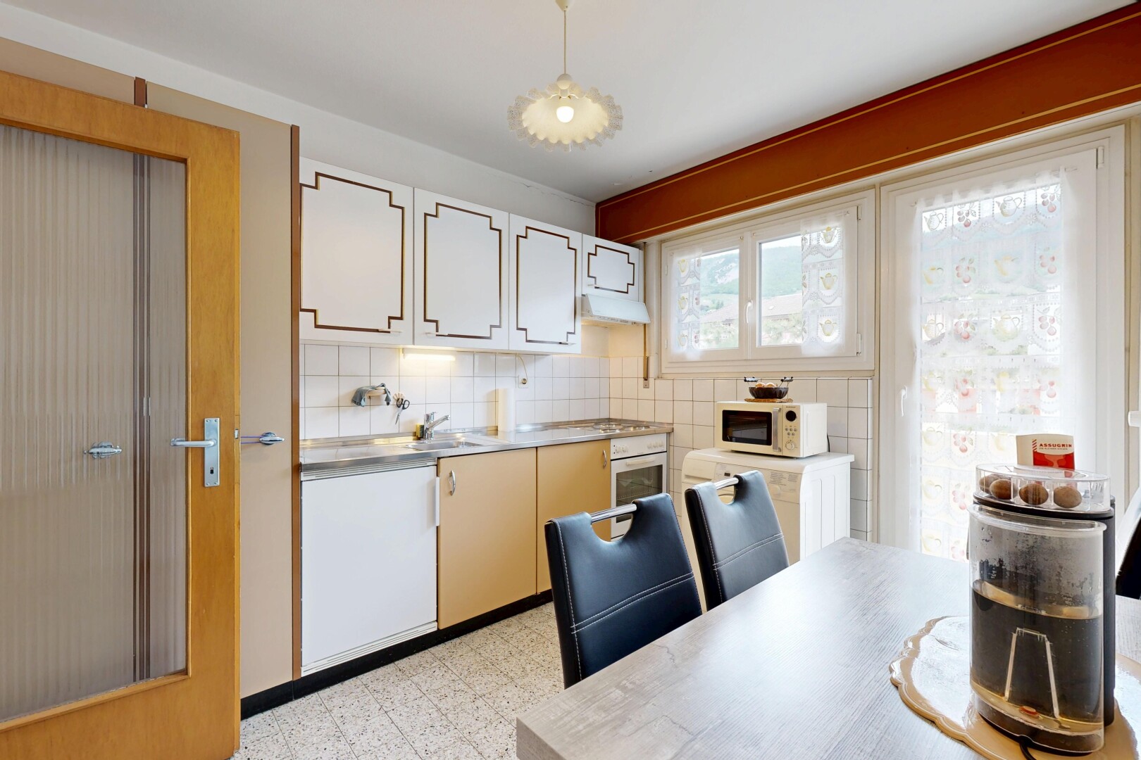 dual tone kitchen with light floors, light countertops, extractor fan, oven, and tasteful backsplash