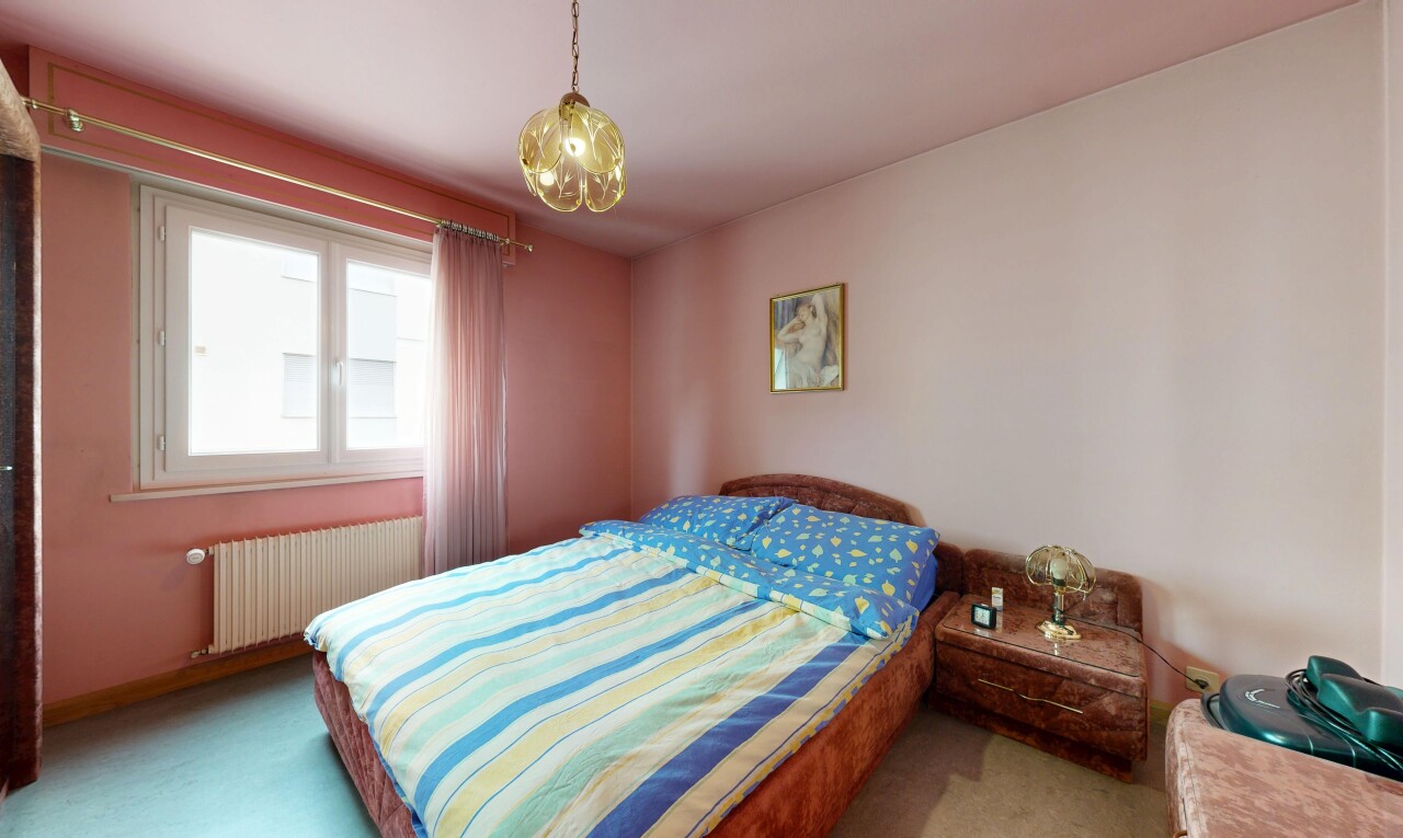 room / bedroom with radiator heating unit and carpet flooring