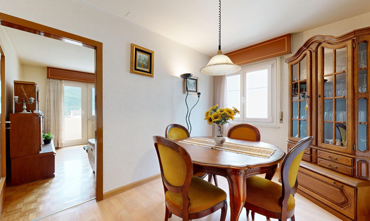 dining space with light wood-type flooring and baseboards