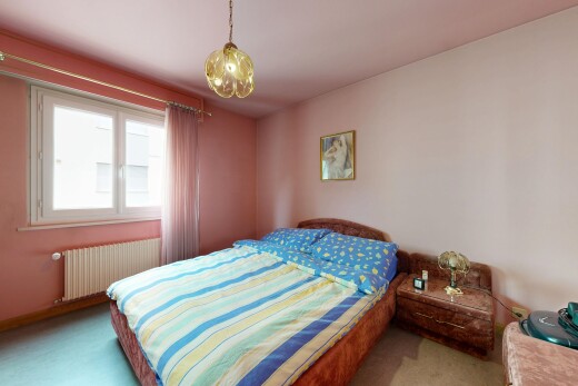 room / bedroom with radiator heating unit and carpet flooring