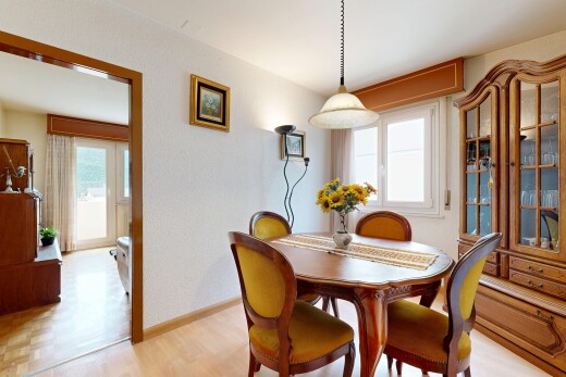 dining space with light wood-type flooring and baseboards