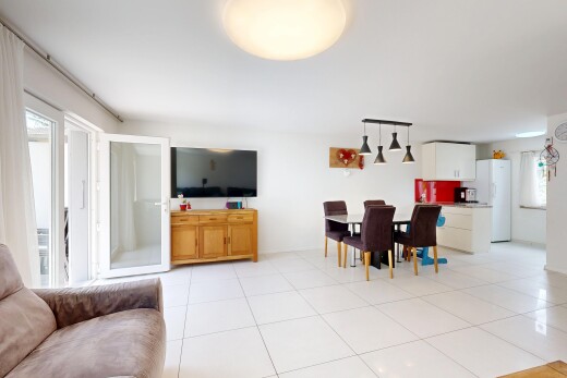 living area with light tile patterned floors