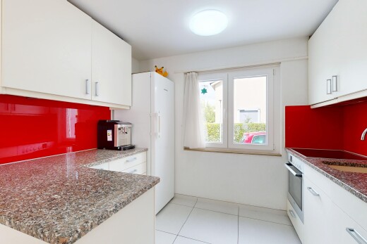 küche mit white cabinets, weiße schränke, dark countertops, ofen, und light floor