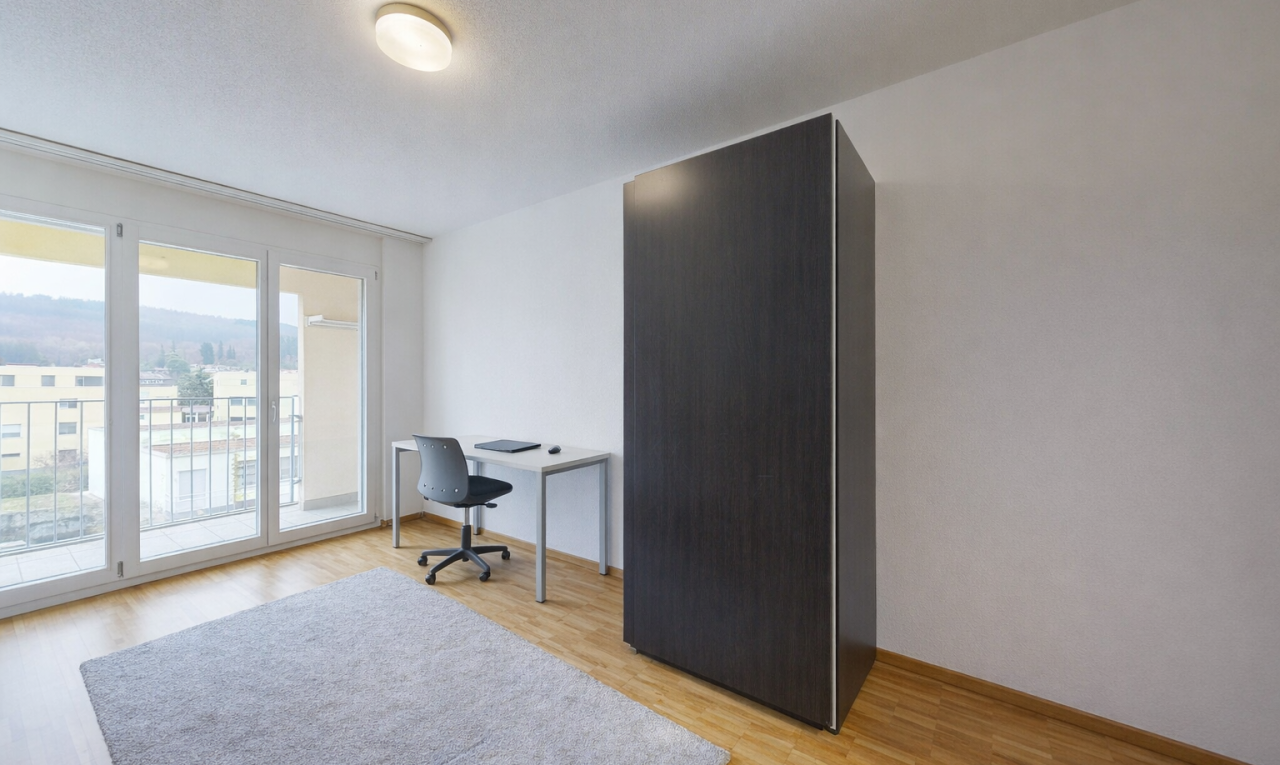office featuring light wood-style flooring and a textured ceiling