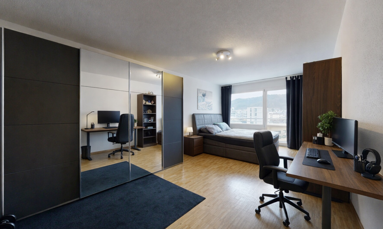 office area with a textured ceiling and light wood-style flooring