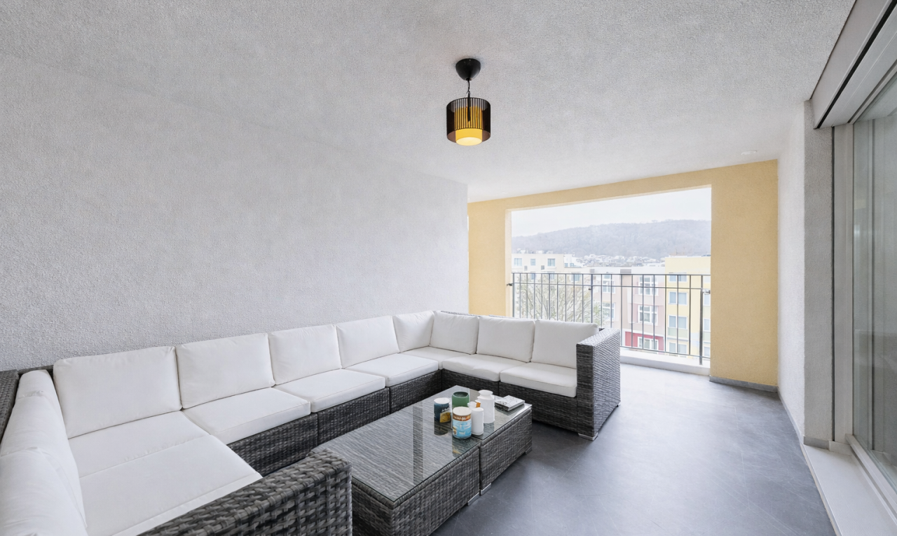 living area featuring finished concrete floors and a textured ceiling
