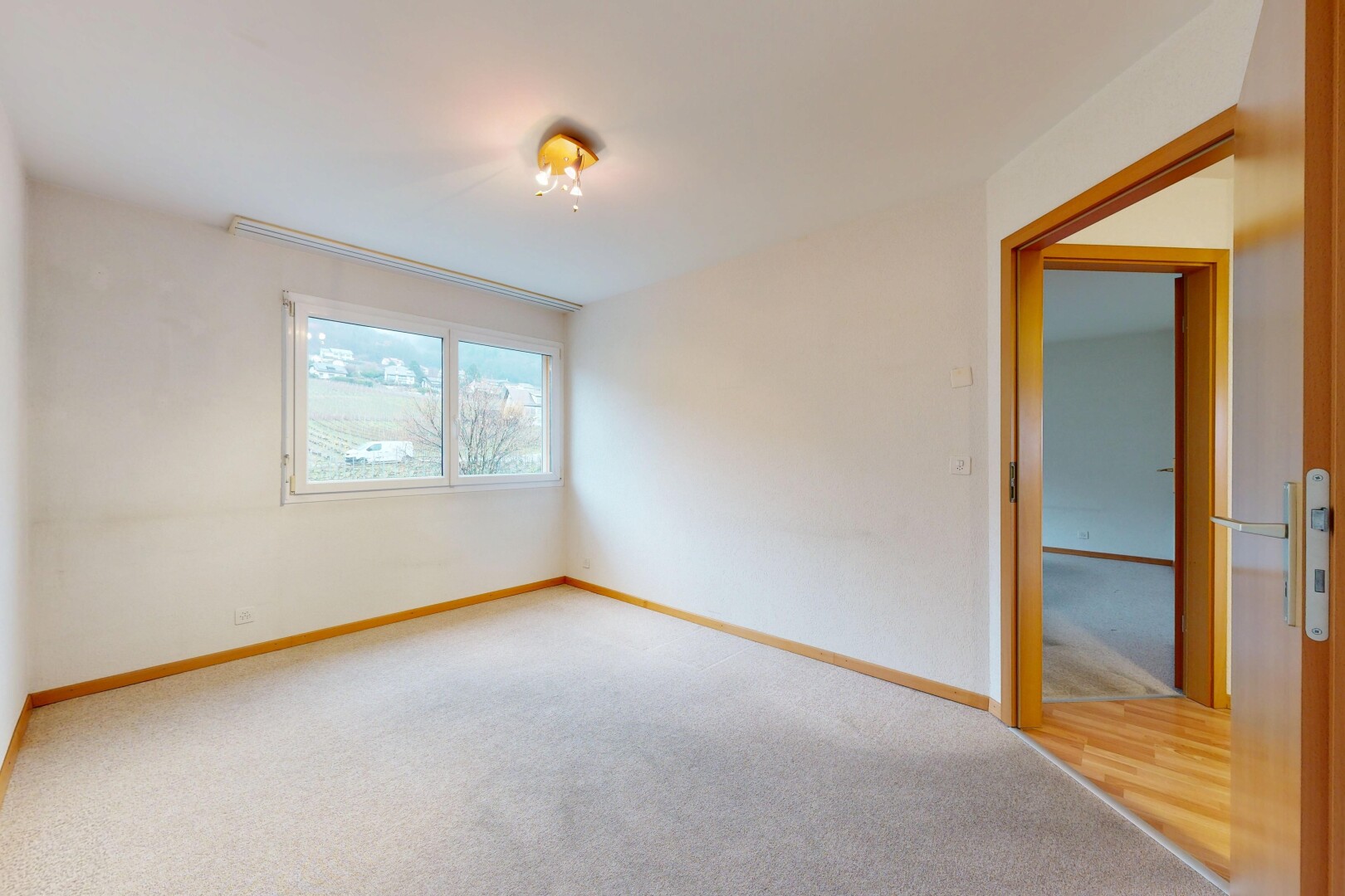 empty room with carpet flooring and baseboards