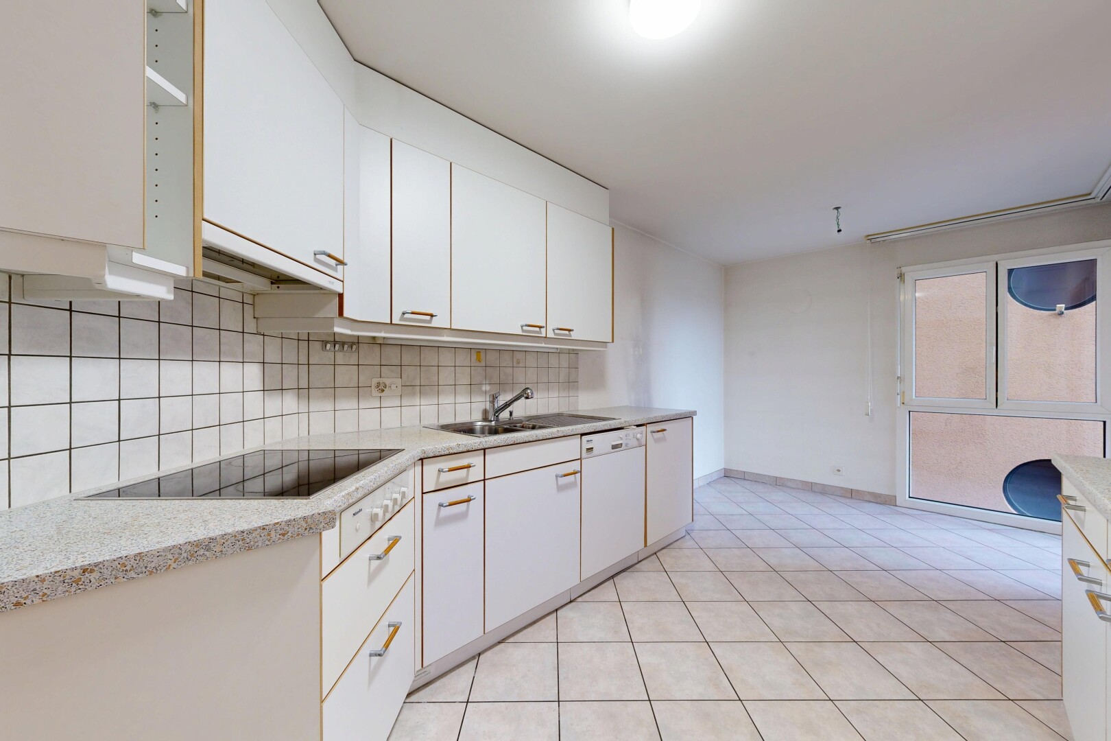 kitchen with white cabinets, white dishwasher, light tile patterned floors, backsplash, and black electric cooktop